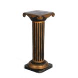 A black painted and gilded Corinthian column, 29cms (11.tins) wide.