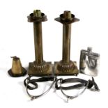 A pair of Trench Art style brass candlesticks, 25cms (9.75ins) high; together with a brass table