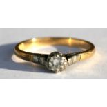 An 18ct gold (tested) diamond solitaire ring, the diamond approximately 0.20pt, approx UK size 'R'.