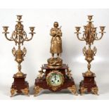 A late 19th century French gilt metal & rouge marble clock garniture, the clock surmounted with a