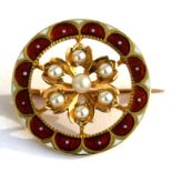 A Victorian unmarked gold and enamel pearl set brooch, 2cms (0.75ins) diameter.