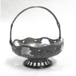 An Art Nouveau W.M.F. style pierced pewter basket decorated with flowers, with glass liner, 24cms (