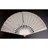 An 18th century bone fan decorated with silver sequins, 47cms (18.5ins) wide (a/f).