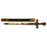 A Victorian drummers sword, the brass handle with 'VR' cipher in a leather scabbard, the blade