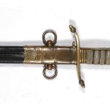 A George V Royal Navy dirk in its leather scabbard with brass mounts. Initials engraved to the