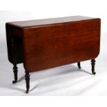 A Victorian mahogany drop-flap table on turned legs, 107cms (42ins) wide.