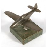 A metal model of a WW2 USAAF P51 Mustang mounted on a marble base. Wingspan 12cms (4.75ins)