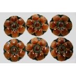 A set of six Sarreguemines majolica oyster plates, 23cms (9ins) diameter.