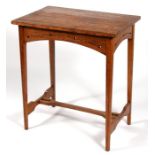 An Arts & Crafts oak occasional table, 66cms (26ins) wide.