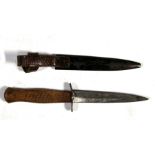 A WW1 German soldiers fighting knife in its steel scabbard with combined leather frog. Makers mark