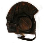 A Royal Air Force Type B brown leather flying helmet. Impressed AM with a Kings crown to the LH