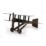 A WWI trench art model of a bi-plane, 10cms (4ins) long.