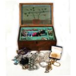 A quantity of costume jewellery in a Victorian figured mahogany crossbanded box, 30cms (11.75ins)