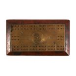 A WW1 casualty trench art brass and wood cribbage board with inscribed name MONTE WELLS. PS/1576