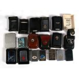 A assortment of 11 Zippo and Zippo style lighters with insignia including Royal Air Force, Bomber