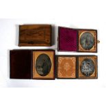 A group of three cased ambrotypes, together with a Jerusalem olive wood notebook containing