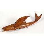 A souvenir of Pitcairn Islands, carved model of a flying fish, inscribed 'Made by a descendant of