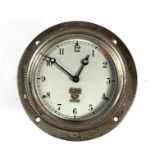 An early 20th century Smiths car clock, the silvered dial with Arabic numerals, the dial 7.5cms (