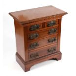 A late 19th / early 20th century mahogany miniature apprentice chest of two short and three long