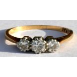 An 18ct gold and platinum three-stone diamond ring, the diamonds approximately .5 carat in total,