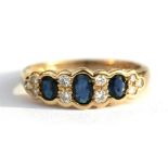 A 9ct gold diamond and sapphire ring, approx UK size 'M'.