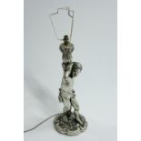 A silvered table lamp in the form a cherub