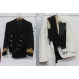 A naval uniform to include waistcoat, trousers, jacket, along with cream blazer and one other