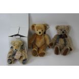 A Merrythought teddy bear, a limited edition Robin Rive bear 60/200 and Martin Hermann limited