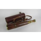 A cased brass telescope in a fitted leather case, the brass extending section