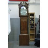 Oak 8 day longcase clock with painted arch dial and moon phase, brass hands and secondary dial