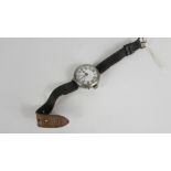 A 1st World War wrist watch, the white enamel dial with luminous Arabic numerals, and hands,