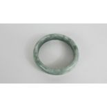 A green Chinese hard stone bangle