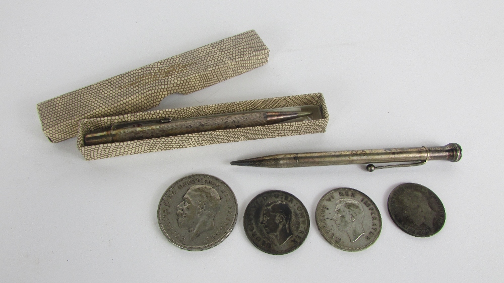 A 1935 full crown, along with two half crowns, a florin and two silver pencils, one cased