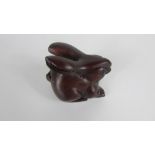 A wooden Chinese carving of a rabbit