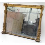 An early 19th Century gilt gesso overmantel mirror of rectangular form, the original plate flanked