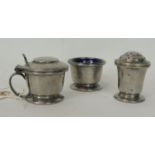 A Liberty and Co three piece pewter cruet with planished finish, stamped top bases & numbered 01076