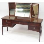A G Plan style mahogany effect dressing table with triple mirror back, 152cm wide