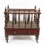 A Victorian walnut Canterbury with slender turned spindles and supports & fitted with single drawer,