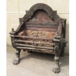 A 19th Century cast iron fire basket having raised back, the sides cast with iron mask ring