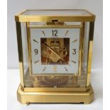 A Jaeger le Coultre Atmos clock in glazed brass case, 22cm high