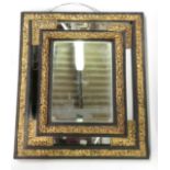 A 19th Century Florentine style wall mirror in ebonised & gilt metal frame and with bevelled central