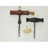A 19th Century corkscrew having shaped mahogany handle, brush & suspension loop, bulbous stem & worm