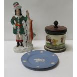 A Staffordshire flatback figure of a huntsman holding a deer; Wedgwood plate commemorating Latimeria