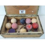 Eight 19th Century ivory billiard balls - 4 red, 1 black & 4 white together with cue tips etc