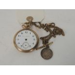 An open face pocket watch having white enamel dial inscribed Hampden Watch Co & in gold plated case