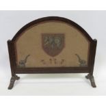 A late 19th/early 20th Century oak framed screen with needlework panel of elephants "Be strong