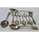 A late Victorian engraved silver preserve spoon together with various other silver spoons, total 5.