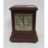 An Edwardian oak cased mantel timepiece with silvered dial & bevelled glass panels, 35cm high,