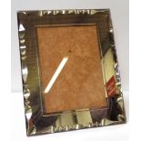 A rectangular rose pink glass photo frame with cut decoration & simulated lizard skin easel back,