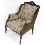 WITHDRAWN A Victorian mahogany framed & upholstered drawing room chair with moulded foliate